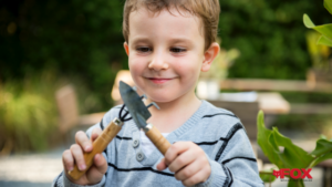 boy with gardening tools